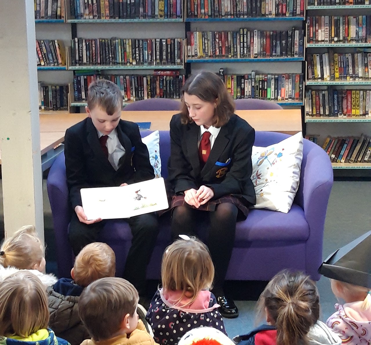 Children reading together in the library